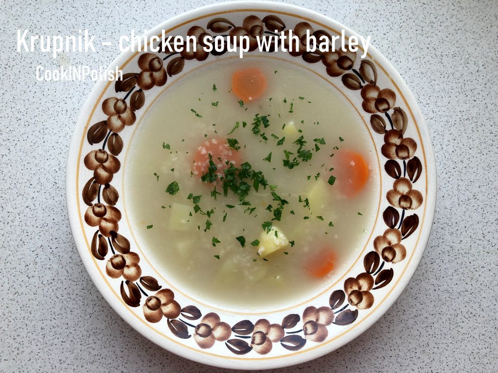 Krupnik chicken soup with barley served on a plate