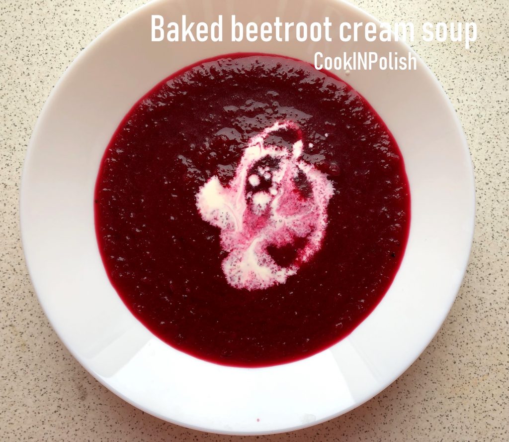 Baked Beetroot cream soup served on a plate with sweet cream