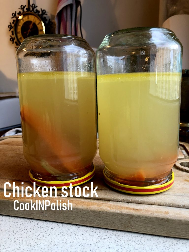Chicken stock in a jar cooling on the table.