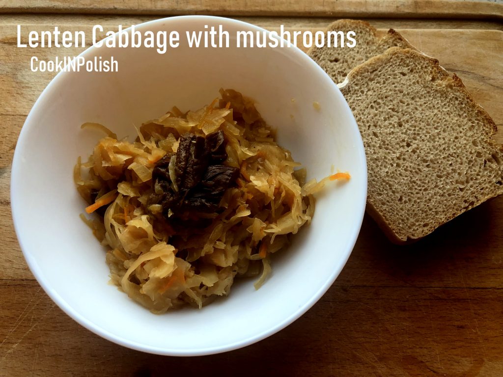 Lenten cabbage with forest mushrooms served on the plate with rye bread.