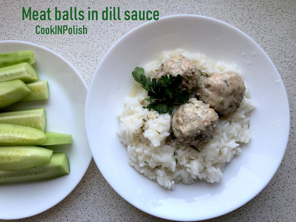 Meat balls in dill sauce served on the plate with rice