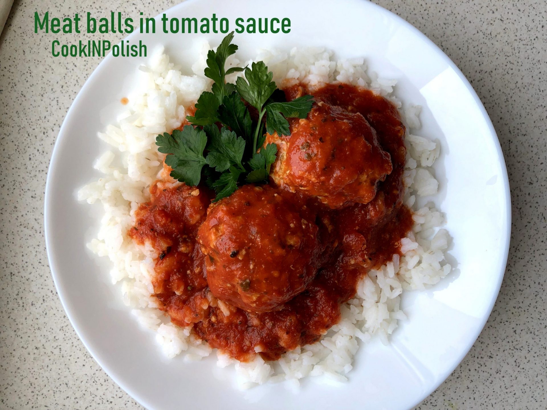 Meat balls in tomato soup served on the plate.