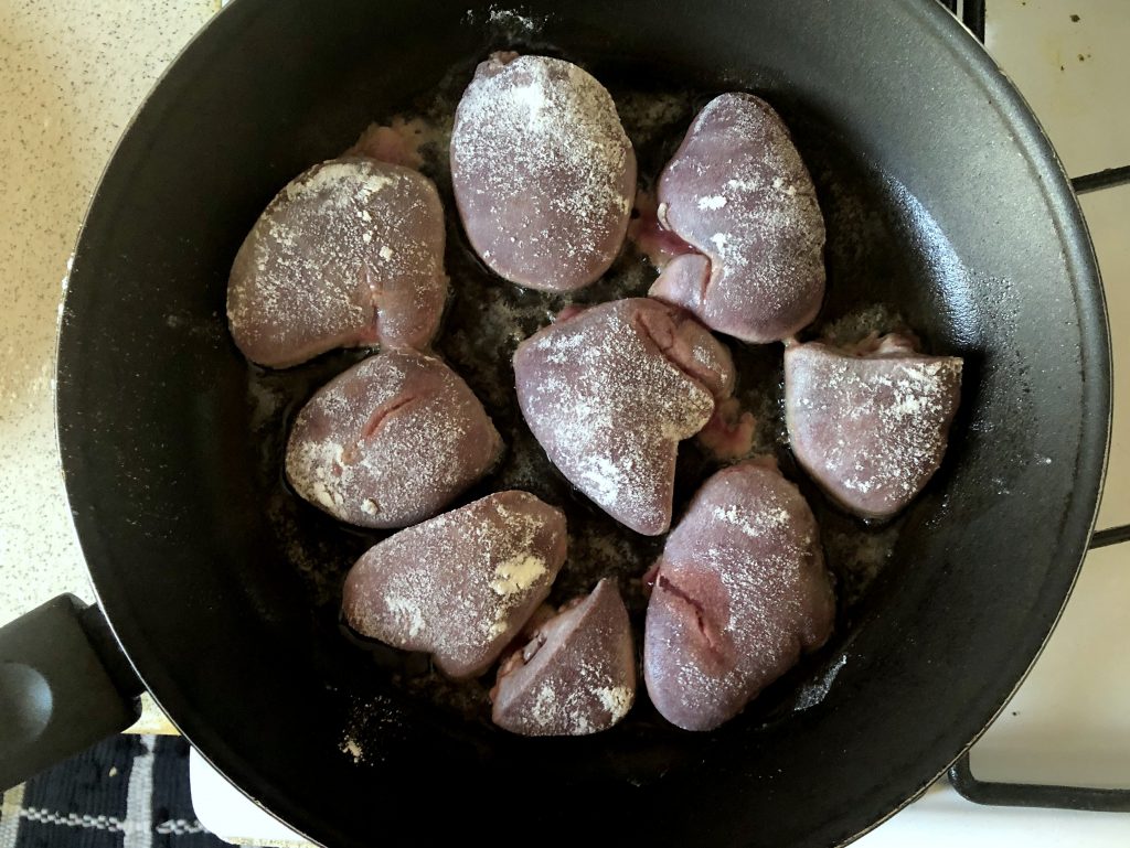 Liver frying on a pan