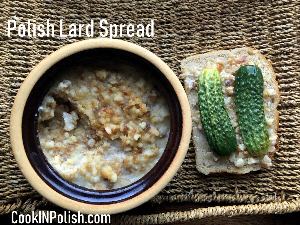 Smalczyk on the rye bread served with Małosolne cucumbers