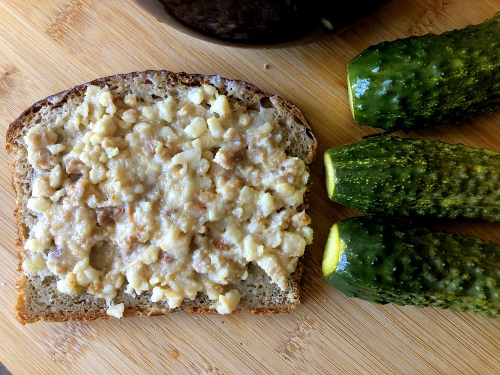 Smalczyk on the rye bread served with Małosolne cucumbers