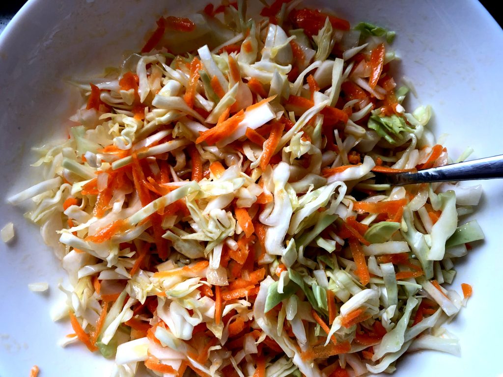 Grated cabbage, onions, carrots - mixed.