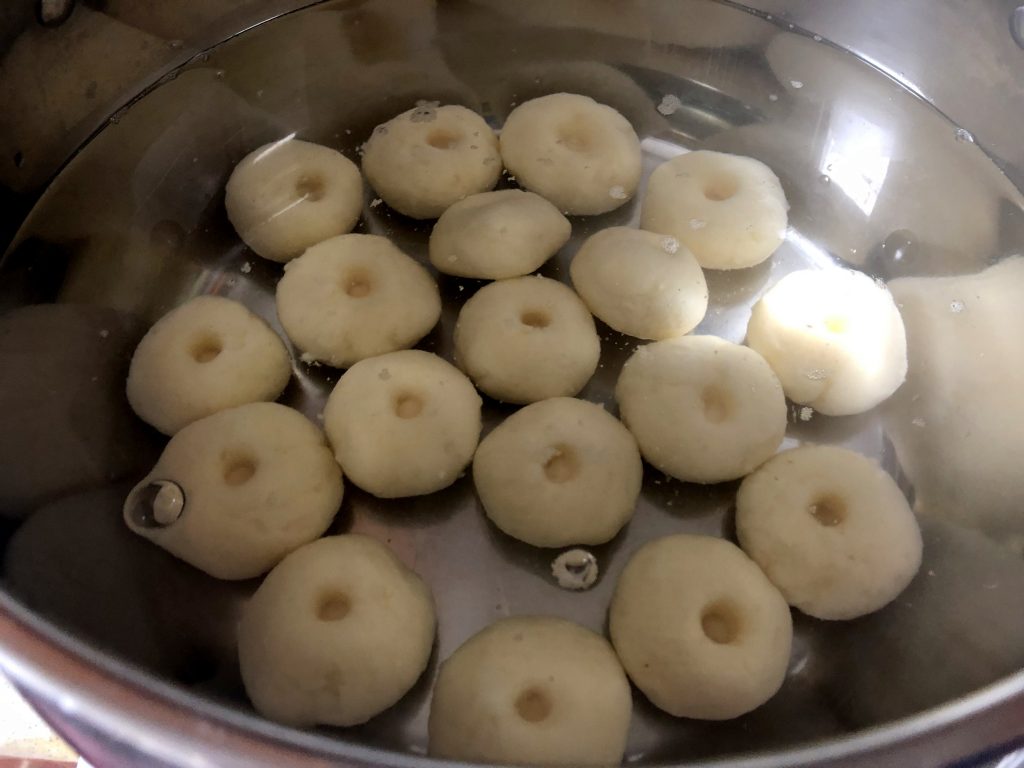 Kluski śląskie/ potato dumplings being cooked.