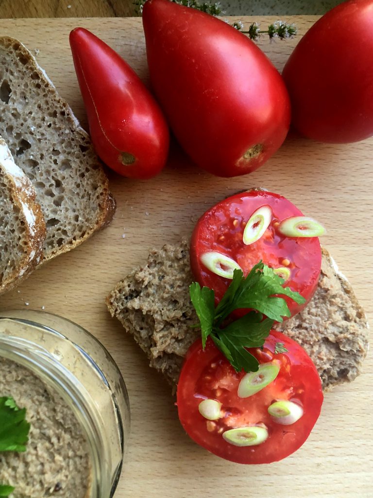 Bread with No baking turkey pate served on rye bread with tomato.