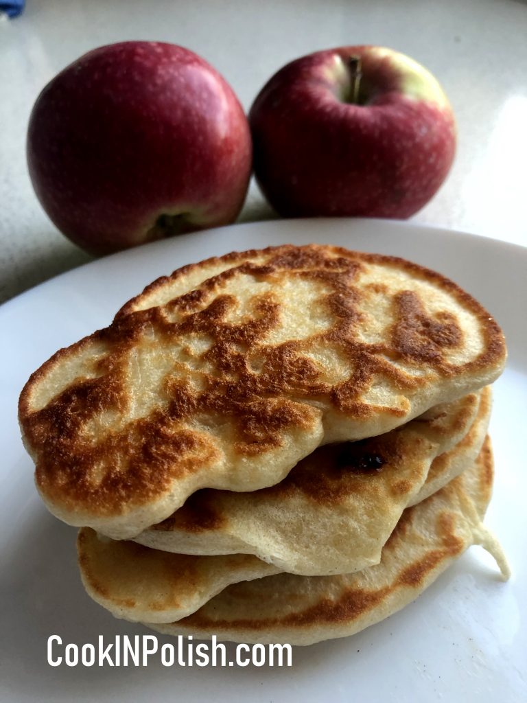 Apple racuchy served on the plate with apples