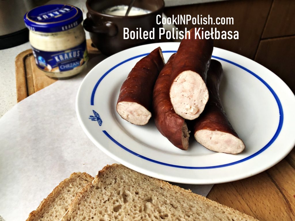 Boiled Polish smoked kiełbasa served with horseradish and bread
