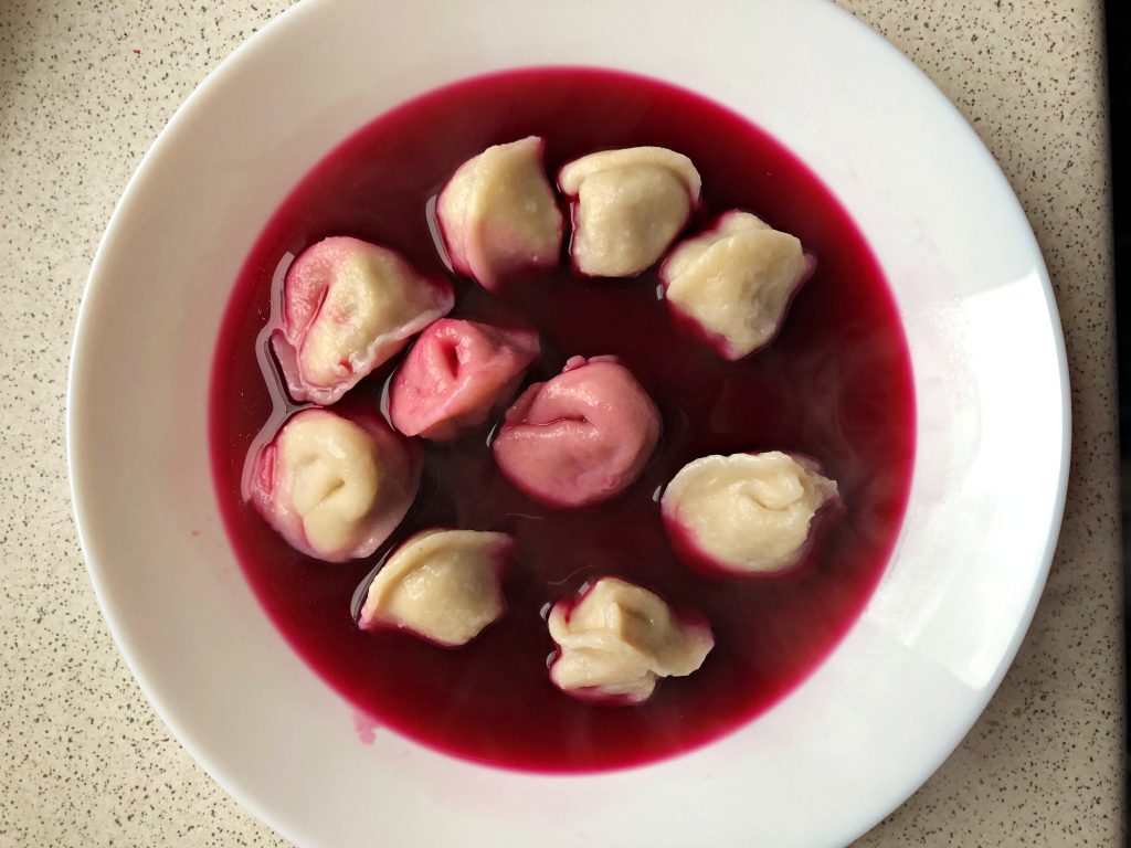 Traditional Polish Soup: Beets Borscht with Uszka served.