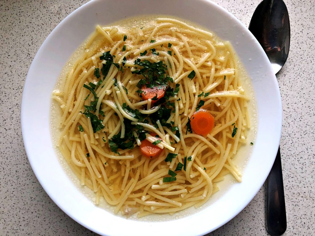 Traditional Polish Soup: Polish rosół served on a plate.