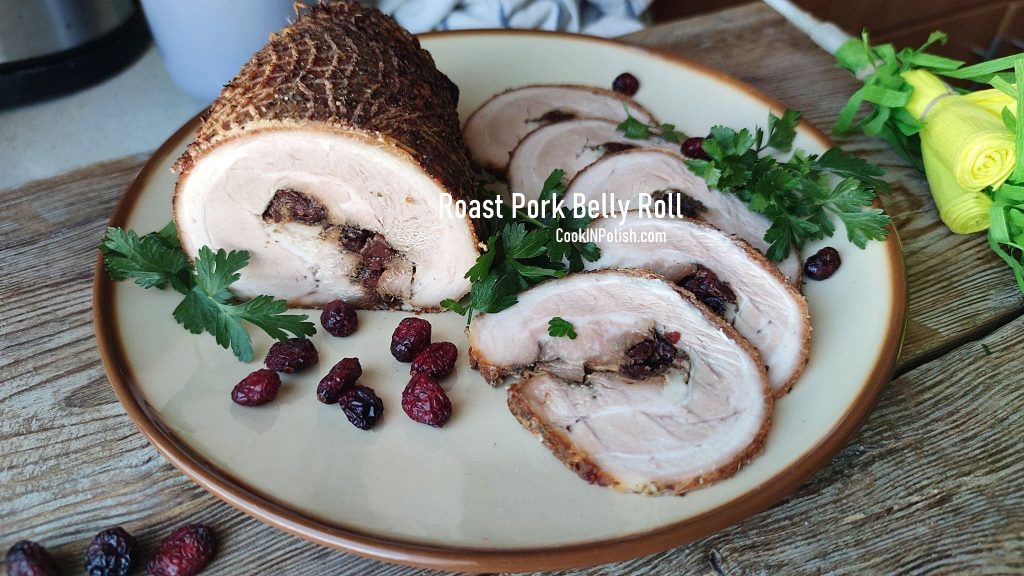 Roast Rolled Pork Belly served on the table