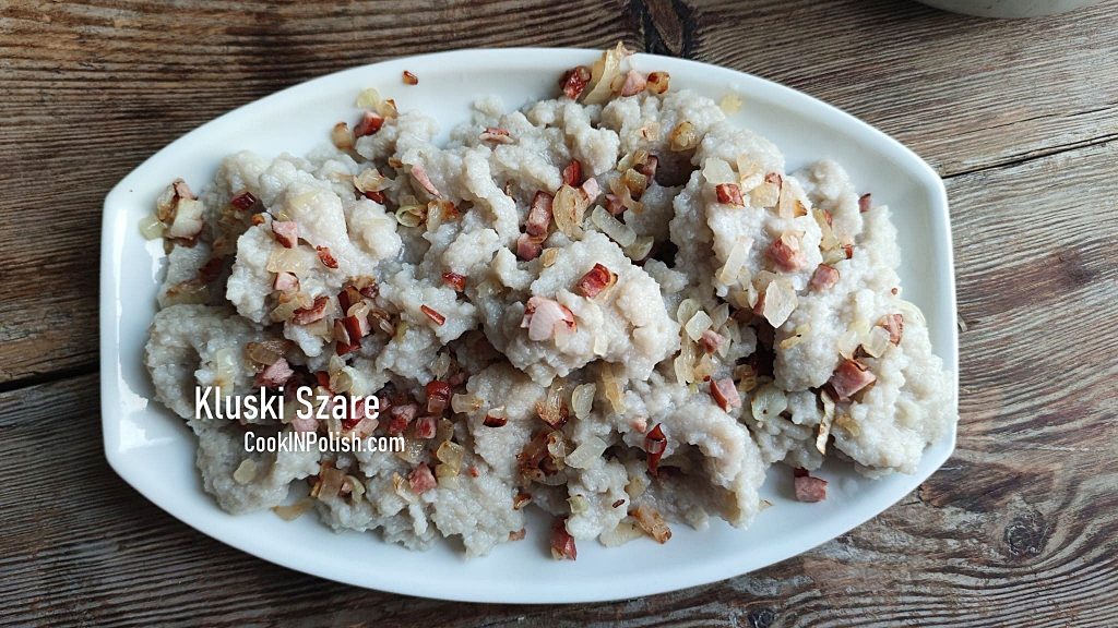 Grey Potato dumplings served with fried onions and kiełbasa