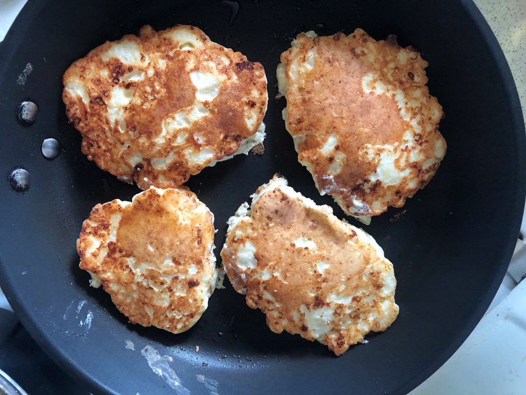 Małdrzyki - White Cheese Pancakes frying on the pan